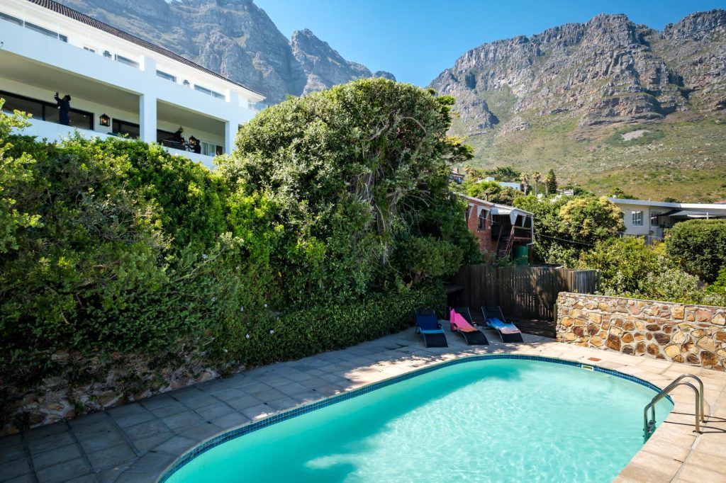 Alma Marina – Private swimming pool nestled beneath the Twelve Apostles, offering a peaceful outdoor retreat surrounded by lush gardens and dramatic mountain scenery.