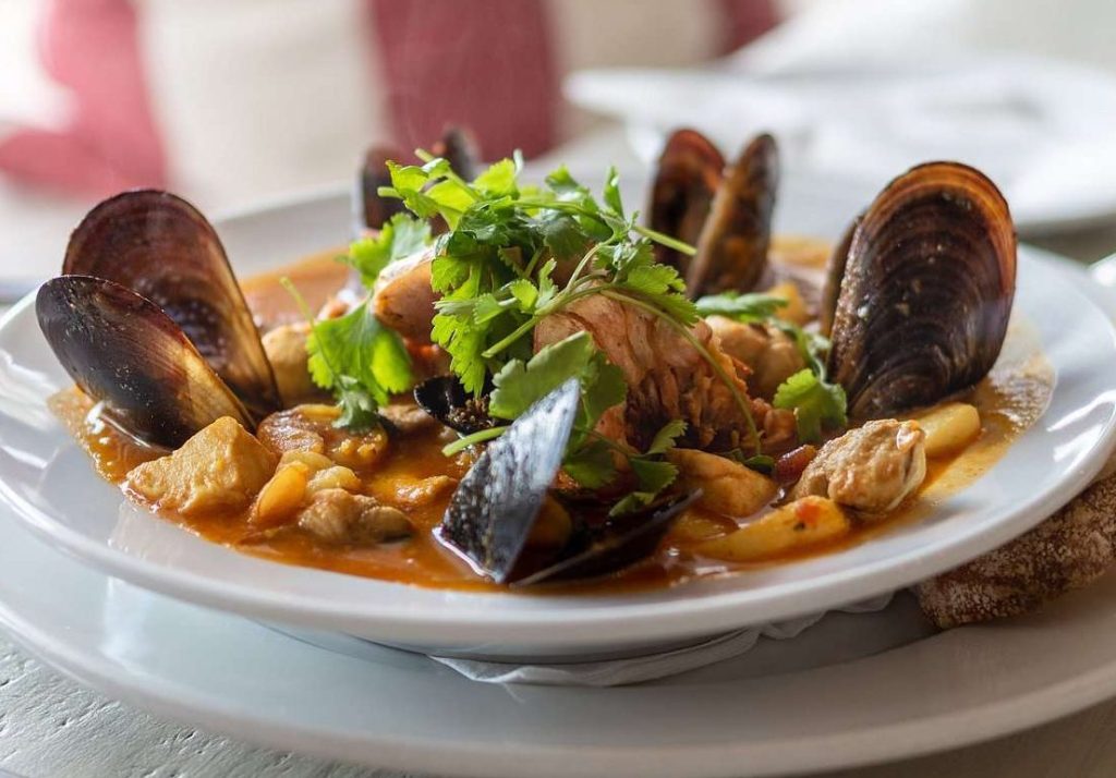 Fresh bouillabaisse seafood stew served at The Lighthouse Café in Simon’s Town, Cape Town