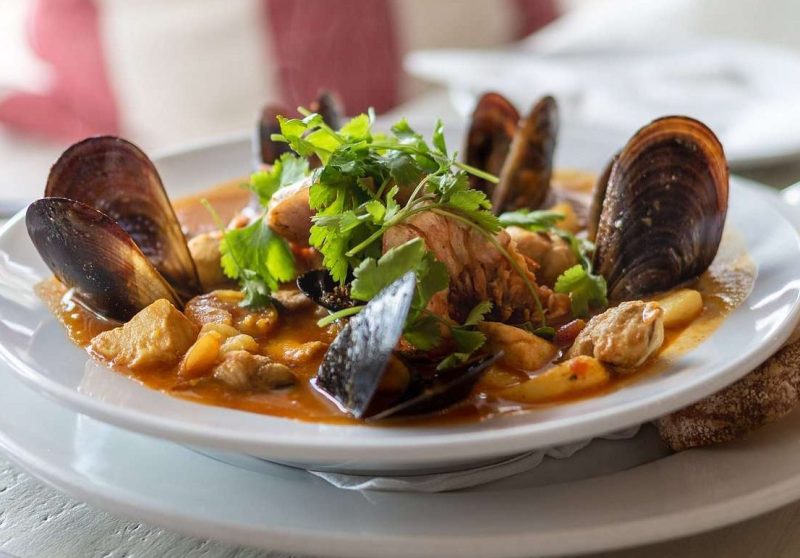 Fresh bouillabaisse seafood stew served at The Lighthouse Café in Simon’s Town, Cape Town