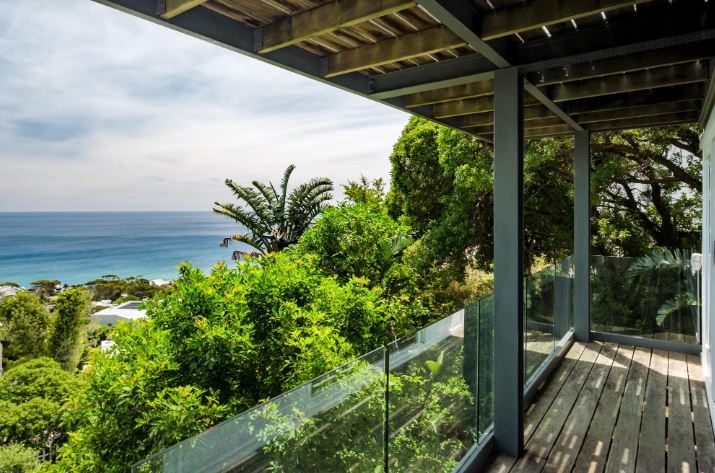 Beleza Villa – Elevated ocean-view deck surrounded by indigenous greenery, offering peaceful outdoor living and sweeping Atlantic vistas.