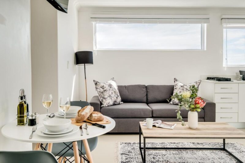 The Cove bright open-plan lounge and dining area