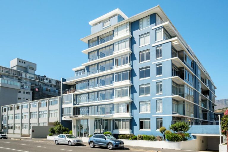 Modern blue beachfront apartment building exterior at Atlantic Vista