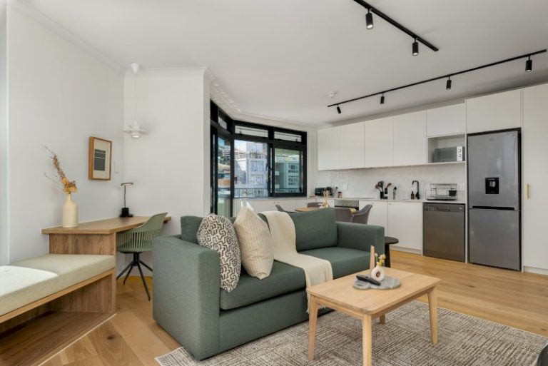 The Sage Sea Point Apartment – Bright open-plan living area with contemporary finishes, fully equipped kitchen, and stylish workspace for remote stays.