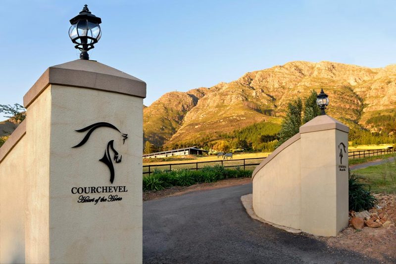 Courchevel – Entrance to the private wine estate, framed by majestic Franschhoek mountain views and the peaceful equestrian setting beyond.