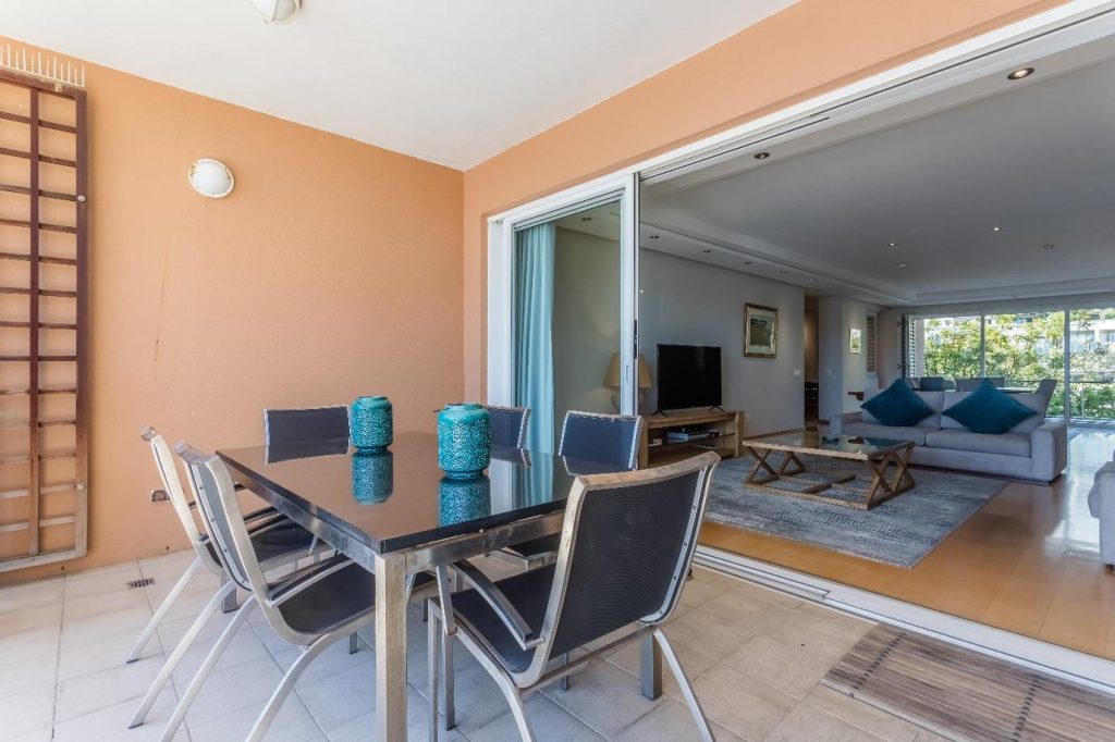 Param 103 – Covered terrace offering relaxed outdoor dining beside the marina