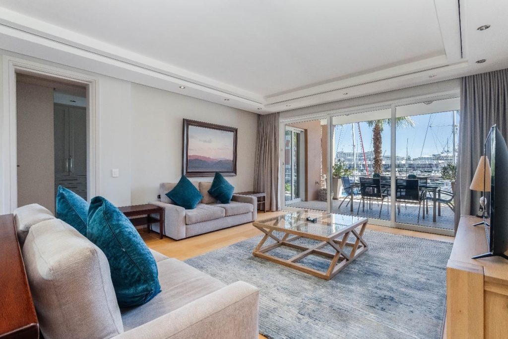 Param 103 – Elegant living room opening onto the marina-facing terrace
