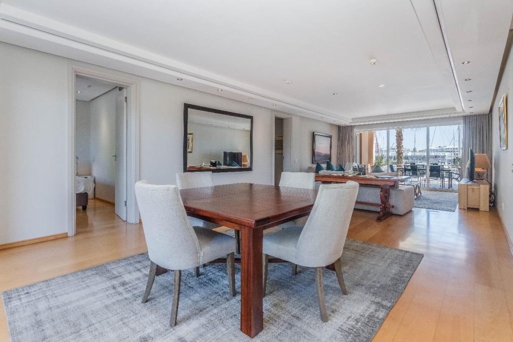 Param 103 – Spacious dining area flowing through to the lounge and marina terrace
