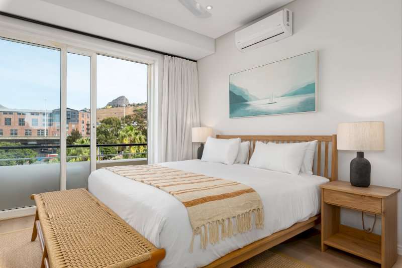 Carradale 3-Bed – Second Bedroom – Beautifully appointed double bedroom with air-conditioning, natural wood furnishings and large windows overlooking the surrounding Waterfront area.