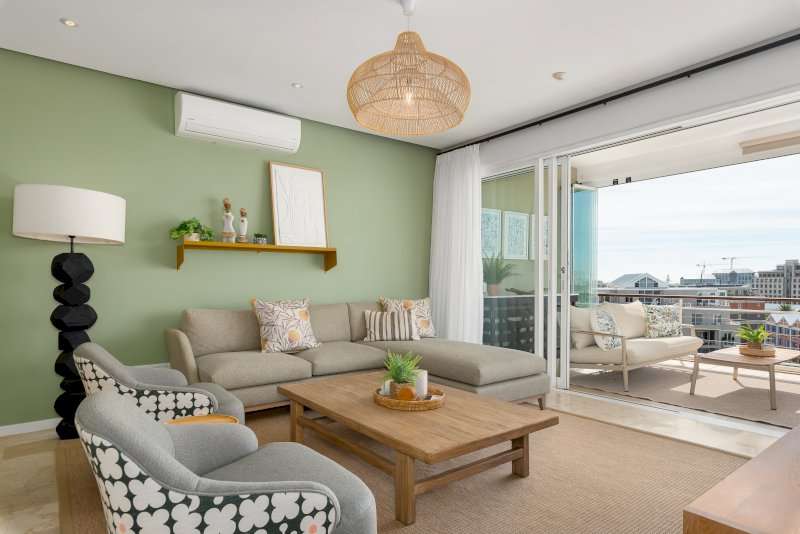 Carradale 3-Bed – Lounge – Beautifully styled living area with comfortable seating, air-conditioning and large sliding doors opening directly onto the balcony.