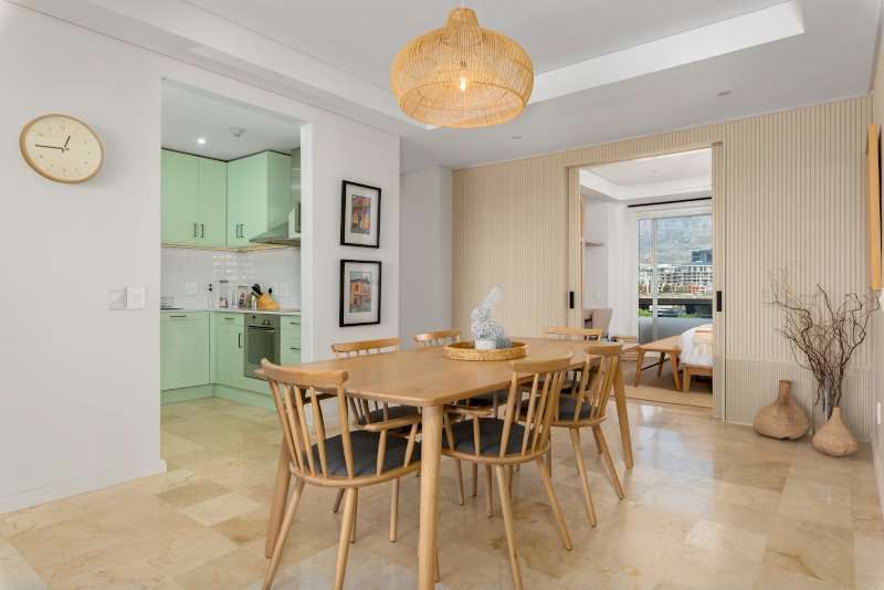 Carradale 3-Bed – Dining Area – Spacious dining area with an eight-seater table, natural finishes and easy access to the kitchen and adjoining living spaces.