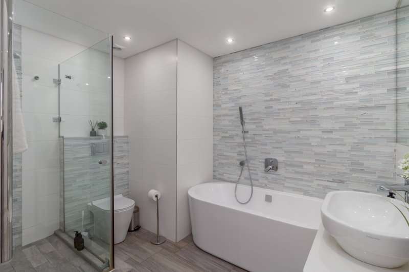 Mouille Point Seaside Stay – Bathroom – Modern bathroom featuring a freestanding bath, separate glass shower and contemporary finishes.