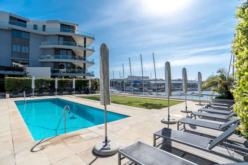 1. Carradale 3-Bed – Swimming Pool – Sunny communal swimming pool with loungers, landscaped surroundings and beautiful views across the marina.