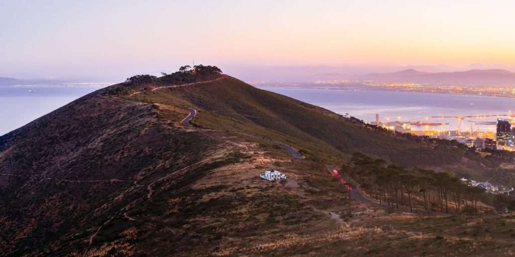 Sunset view from Signal Hill overlooking Cape Town and Table Mountain.