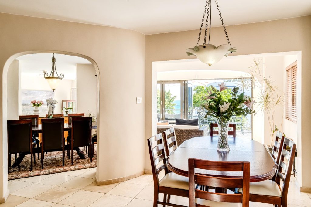 Kaya Eden – Inviting dining area connecting seamlessly with the formal dining room and sun-filled living spaces beyond.