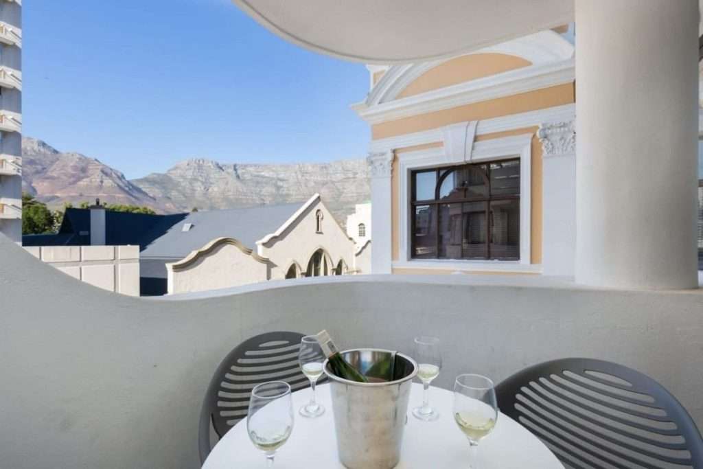 The Tuynhuys – Balcony & Mountain View – Private balcony with outdoor seating and a wonderful outlook towards Table Mountain, perfect for enjoying a glass of wine.