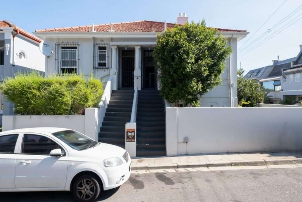 Timeless Sea Point Retreat – Classic Exterior – Charming character home with an elevated entrance, traditional tiled roof and established greenery in the heart of Sea Point.