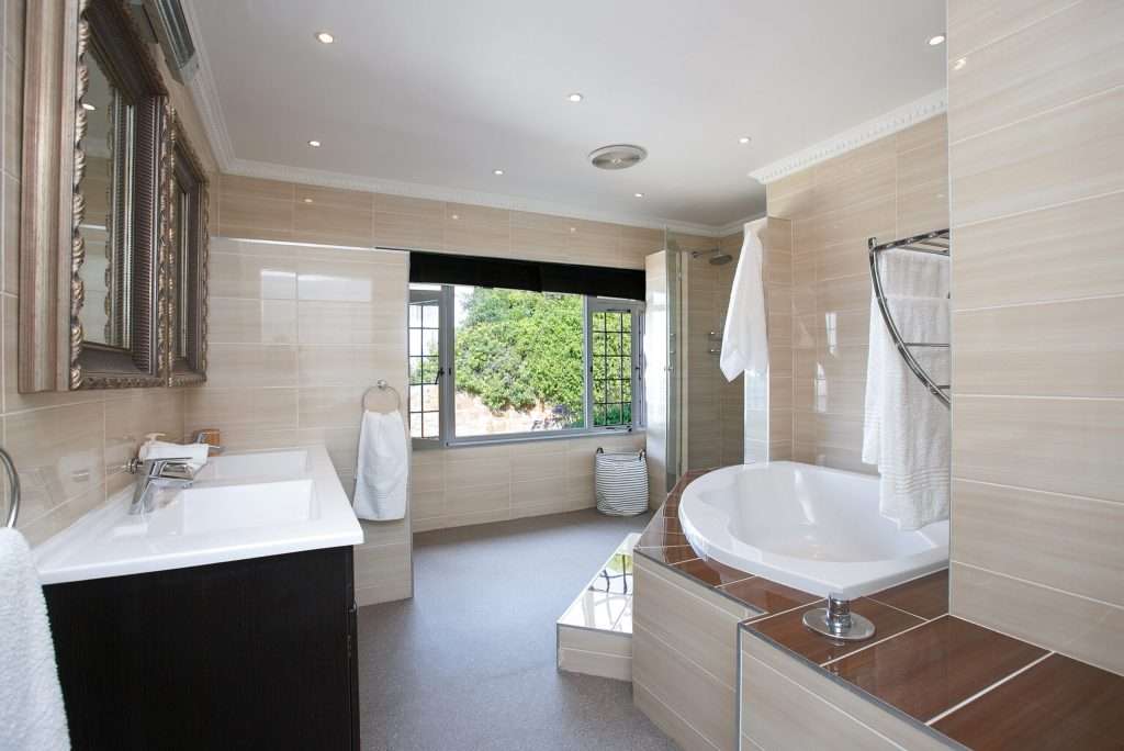 The Perch – Bathroom – Spacious contemporary bathroom featuring a freestanding bath, separate shower and generous double vanity.