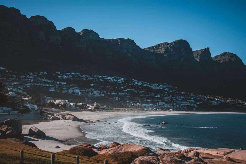 Scenic view of Camps Bay beach with the Twelve Apostles mountains.