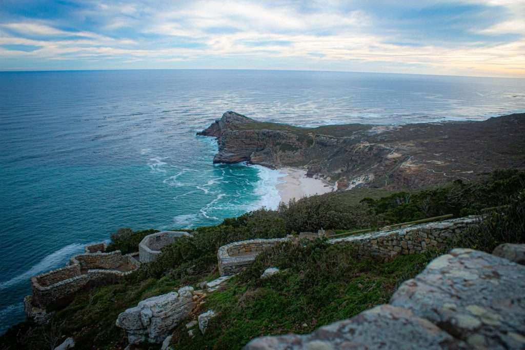 Cape Point Peninsula coastline with dramatic cliffs and ocean waves.