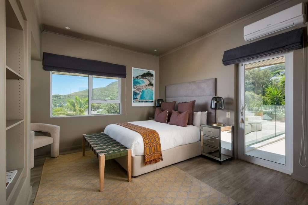 Kinvara Villa – Guest Bedroom – Elegant guest bedroom with contemporary furnishings, air conditioning and direct access to a sunny outdoor terrace.